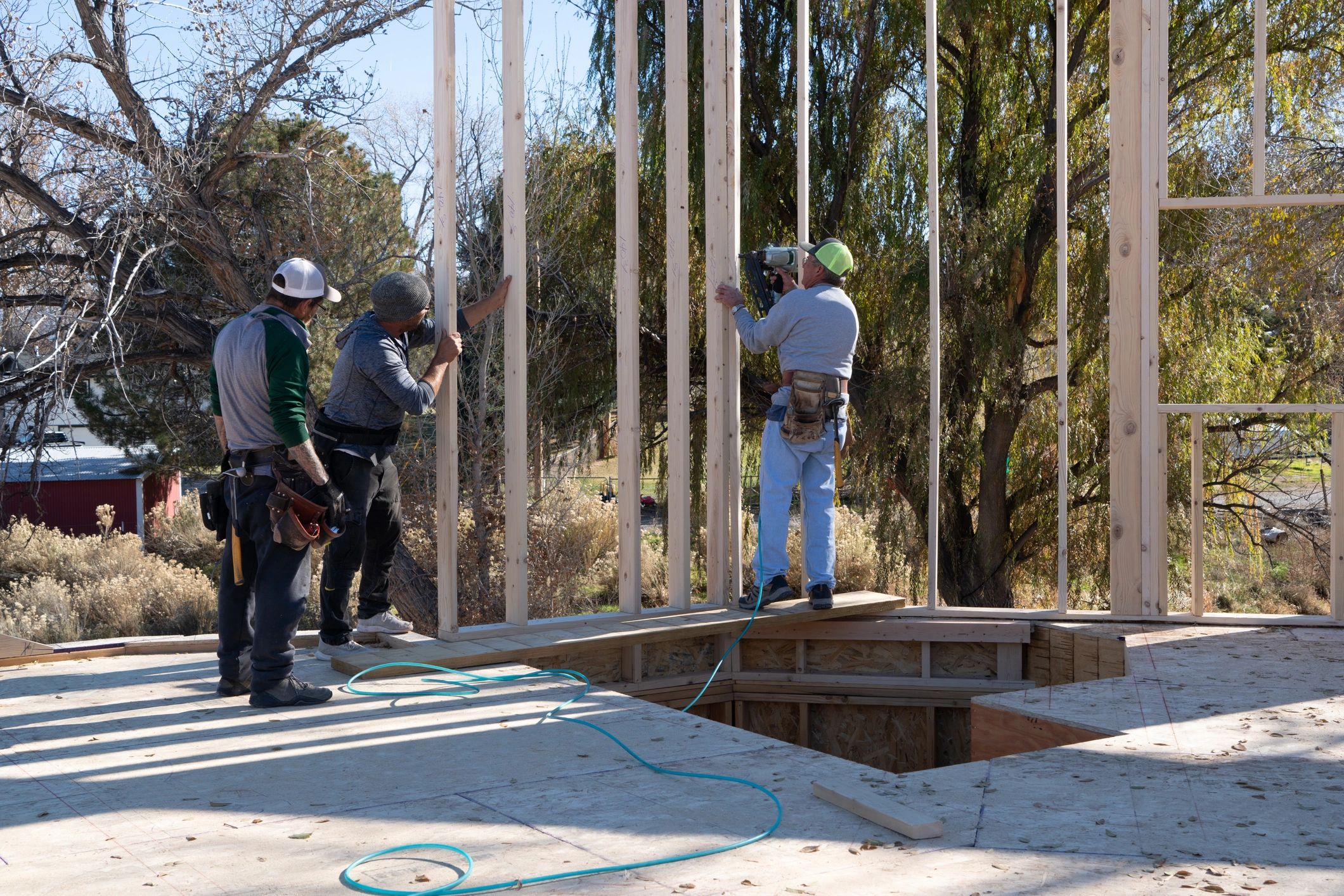 Construction workers framing a house structure