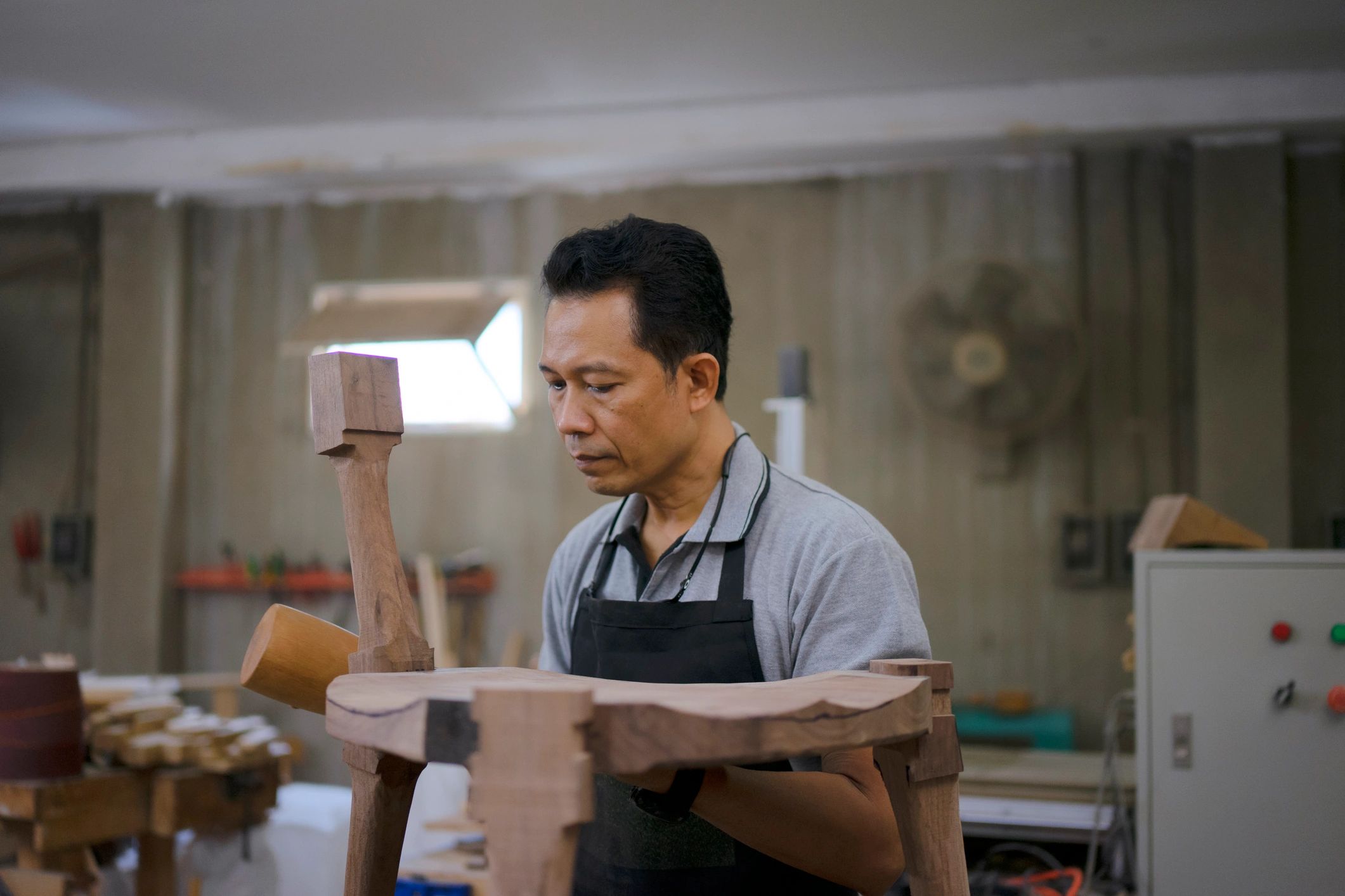 Carpenter working on wood in a workshop
